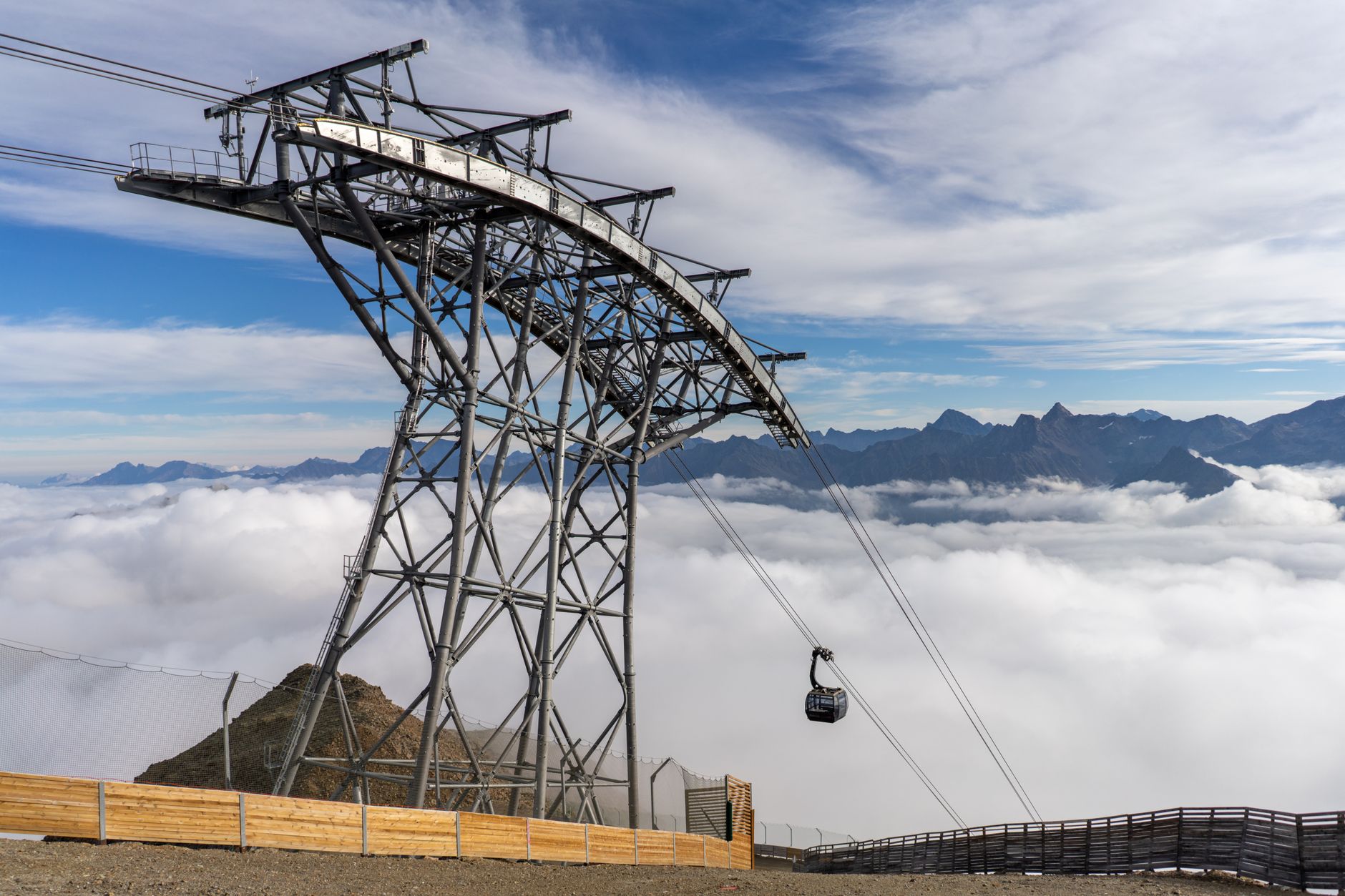 Majestic view of a gondola lift above clouds in Sölden, Tirol, Austria. — photograph by Nico Becker on Pexels