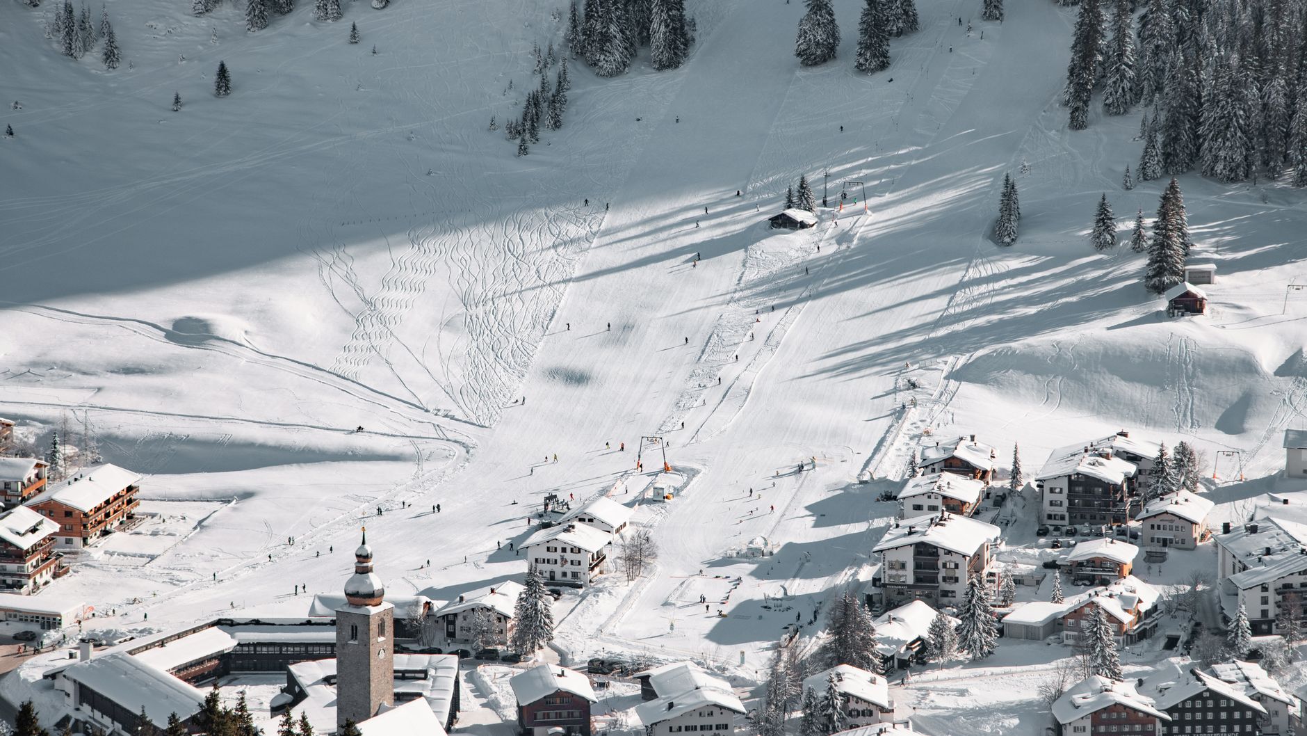 A beautiful aerial view of snowy ski slopes and village in Lech am Arlberg, Austria. — photograph by Tobi &Chris on Pexels